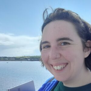 SYP Head of Participation and Programmes Rosy Burgess smiling overlooking water