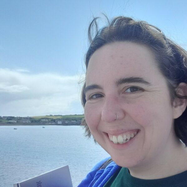 SYP Head of Participation and Programmes Rosy Burgess smiling overlooking water
