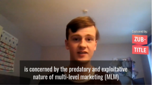 Image of Jack Bell MSYP with short brown hair and a red t-shirt giving a speech over Zoom. The subtitles read 'Is concerned by the predatory and exploitative nature of multi-level marketing (MLM) schemes