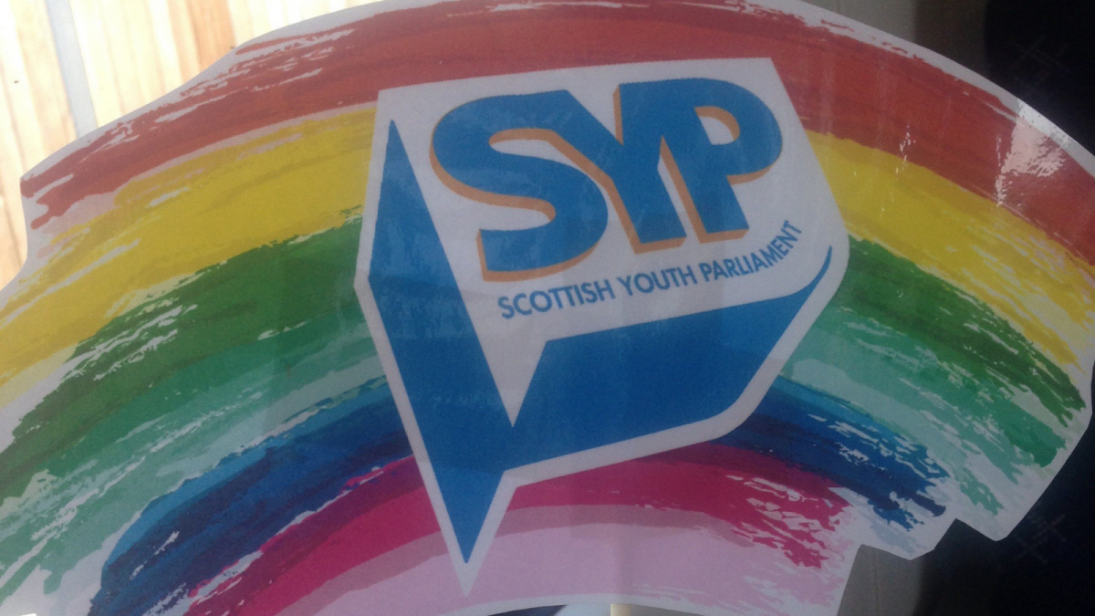 Image of a rainbow drawing with the SYP logo in front of the rainbow.
