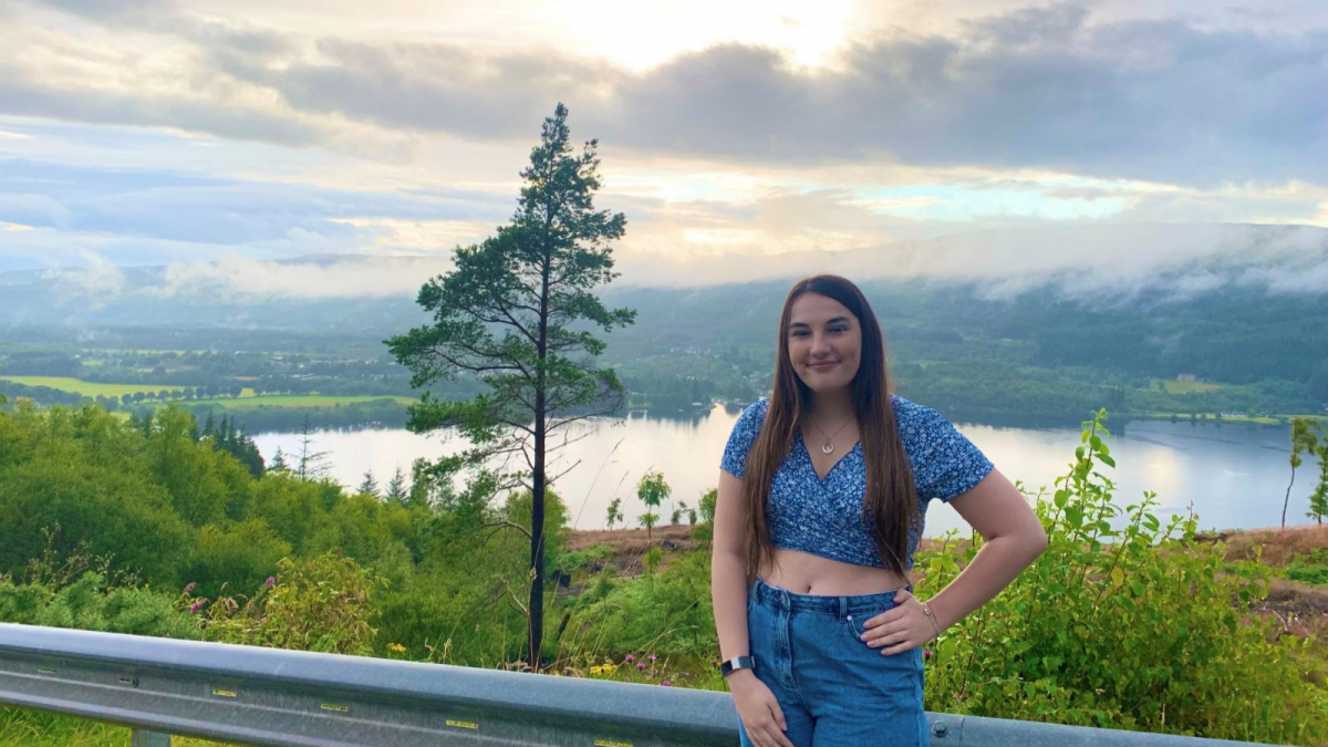 A picture of Mollie McGoran MSYP standing in front of a loch