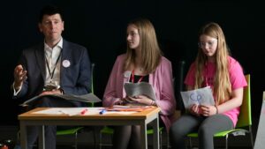 Image of Scottish Government Permanent Secretary John-Paul Marks, SYP Chair Ellie Craig MSYP and a Member of the Children's Parliament.