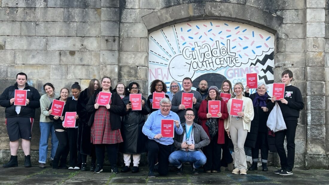 Launch of Youth Work (Scotland) Bill at Citadel Youth Centre in Leith, Edinburgh. SYP CEO Jamie Dunlop at the back, alongside other sector colleagues and young people with Martin Whitfield MSP at the front.