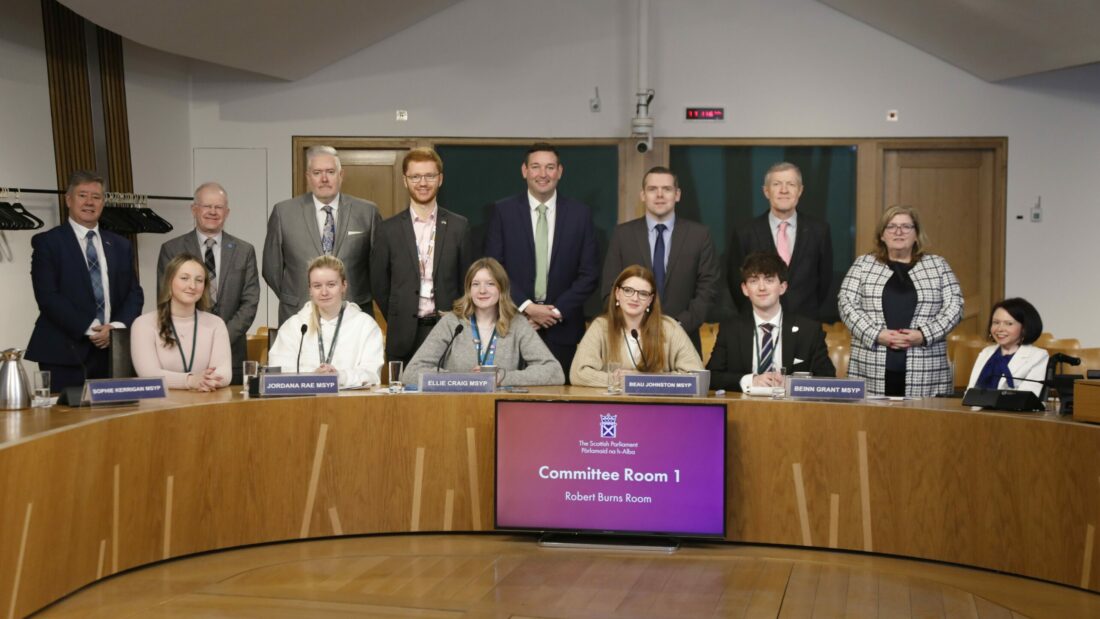 MSYPs and MSPs at the Education, Children and Young People Committee session. Front row, from left to right; Sophie Kerrigan MSYP, Jordana Rae MSYP, Ellie Craig MSYP, Beau Johnston MSYP and Beinn Grant MSYP. Back row, from left to right; Keith Brown MSP, John Mason MSP, George Adam MSP, Ross Greer MSP, Miles Briggs MSP, Douglas Ross MSP, Willie Rennie MSP, Jackie Dunbar MSP and Pam Duncan-Glancy MSP.